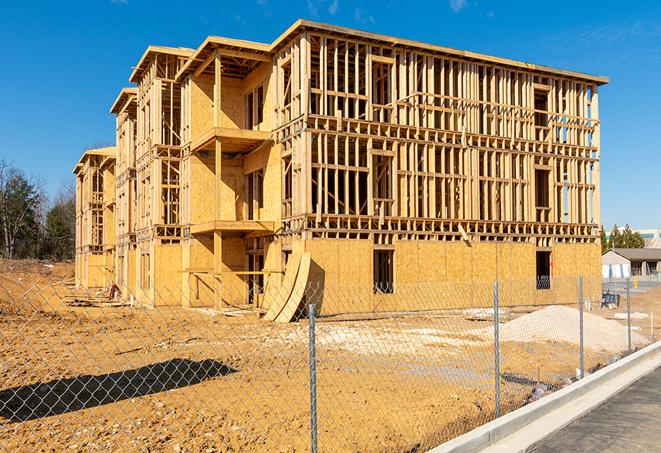 a snapshot of temporary chain link fences protecting a large construction project from unauthorized access in Eau Claire